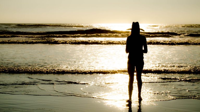 Woman in a bikini by the water
