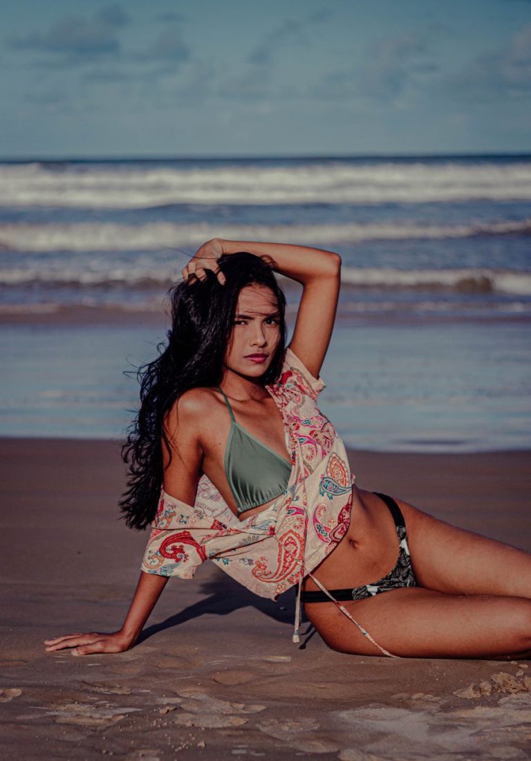 Woman in a bikini by the water